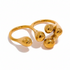 Reneax and Company gold double-finger ring with a sculptural liquid metal design and high-polish finish