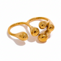 Reneax and Company gold double-finger ring with a sculptural liquid metal design and high-polish finish