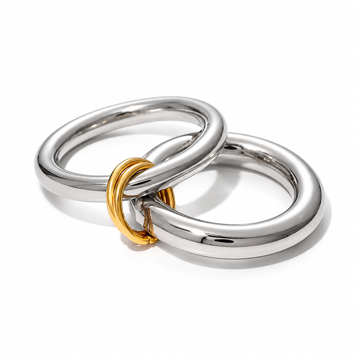 Reneax and Company interlocking mixed metal ring featuring two polished silver-tone bands joined by a gold-tone link.
