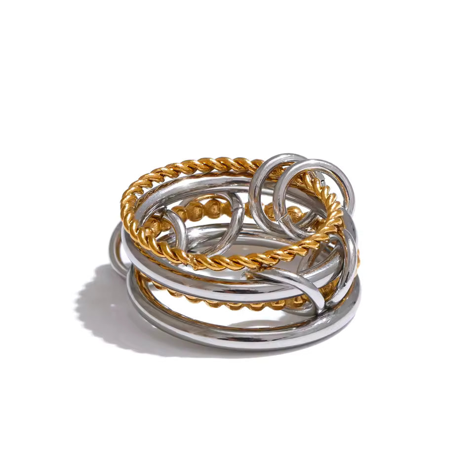Reneax and Company interlocking multi band statement ring featuring polished silver and gold twisted rope textures.